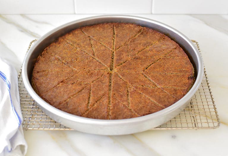 Lebanese kibbeh sahnieh in a round pan with diamond cuts