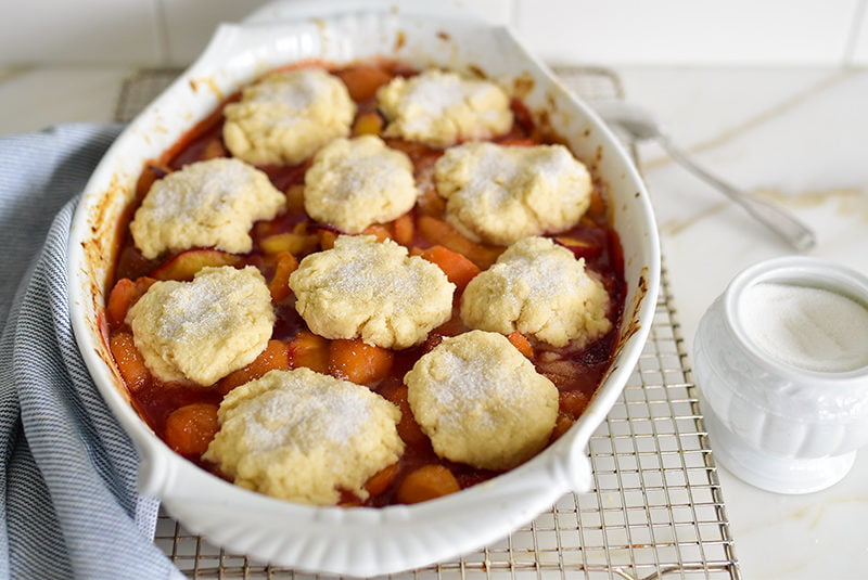 Sugared cobbler biscuits in the pan before baking