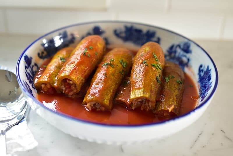 Stuffed squash with tomato sauce.