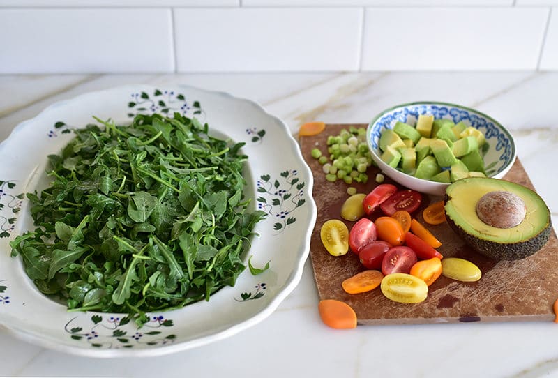 Arugula and trimmings for Mujadara salad