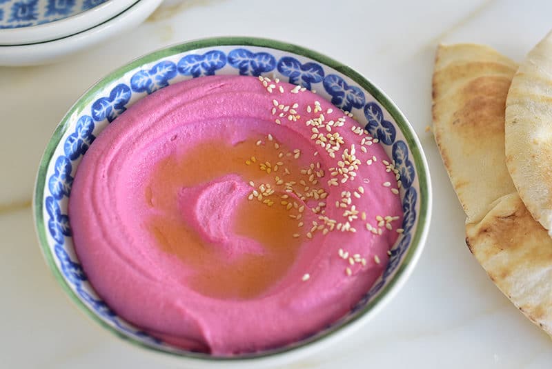 Red beet hummus with sesame seeds and olive oil