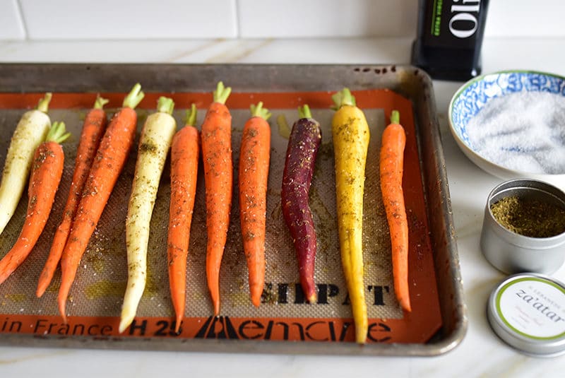 Carrots coated with za'atar on a sheet pan