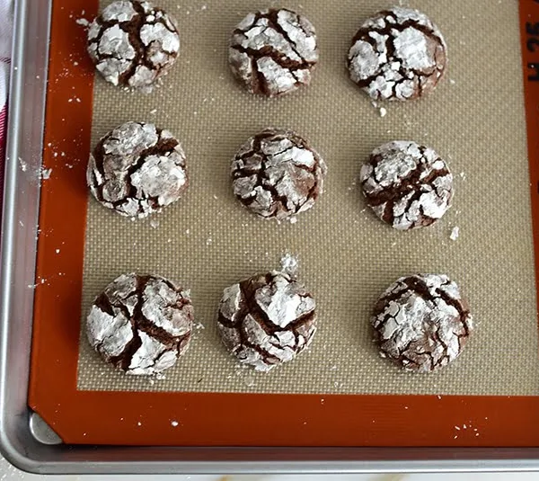 Chocolate crinkle cookies with orange blossom on a silpat