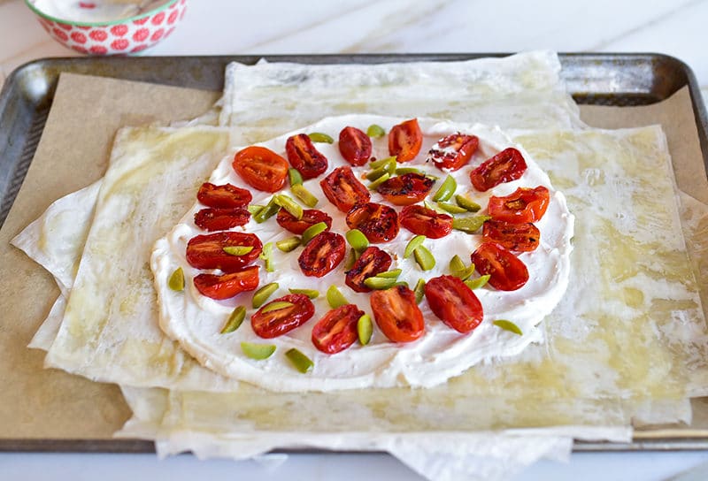 Tomatoes and olives atop phyllo for savory phyllo galette