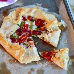 Savory Phyllo Galette on a sheet pan with a slice cut