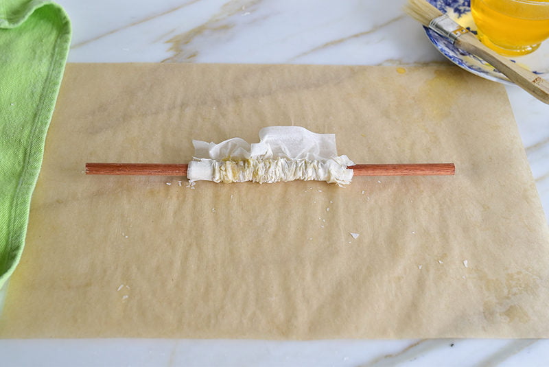 Phyllo pushed into an accordion pleat on a dowel