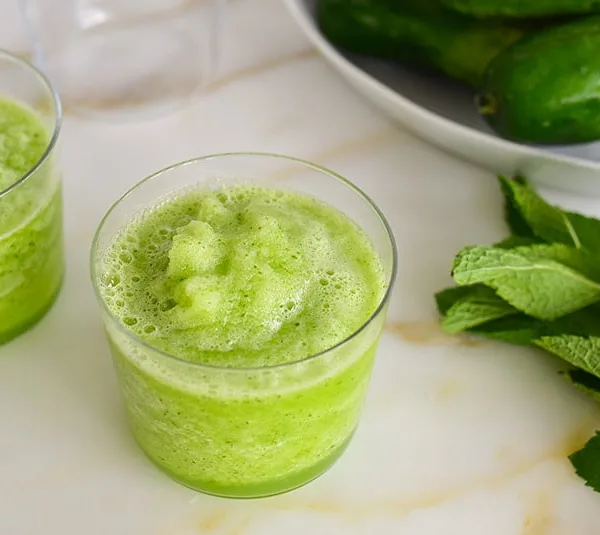 Fresh Mint Slushie with fresh mint and cucumbers on the counter
