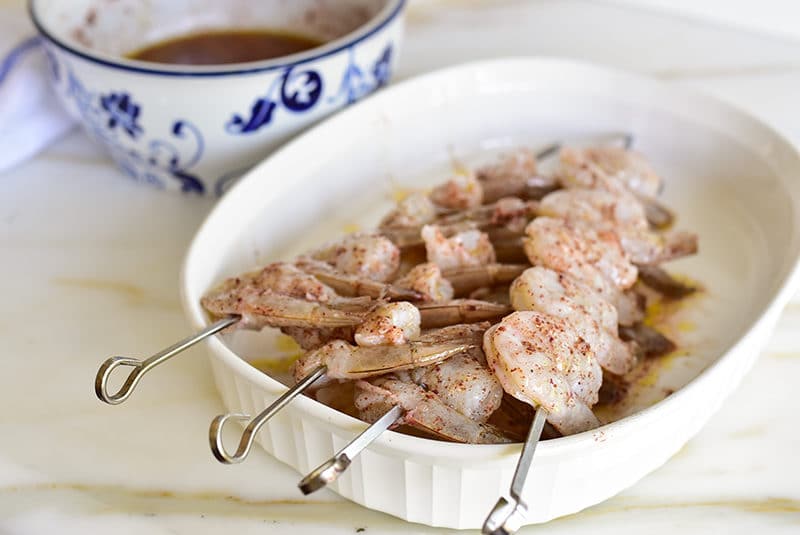 Marinated sumac shrimp threaded on metal skewers