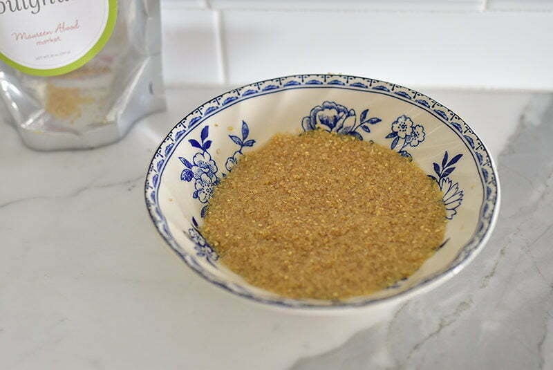 Bulgur wheat soaking in a blue and white bowl