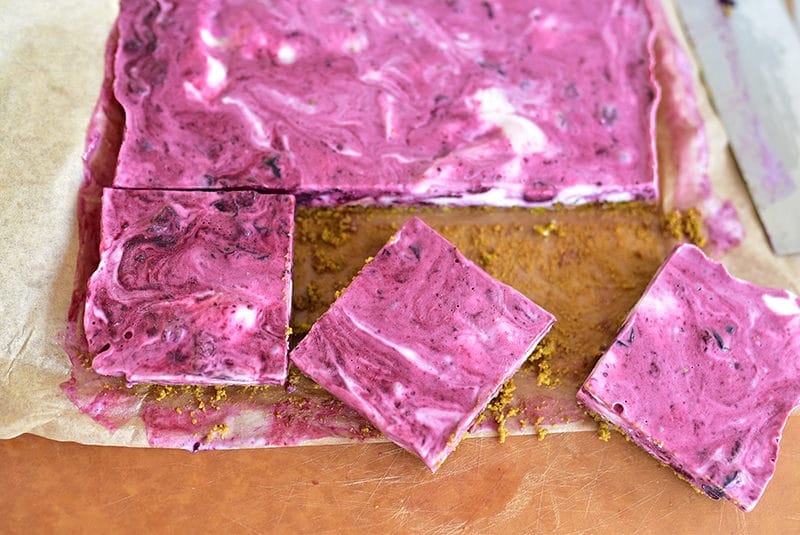 Blueberry frozen yogurt bars on a cutting board