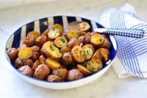 Roasted New Potatoes in a blue striped bowl on the counter