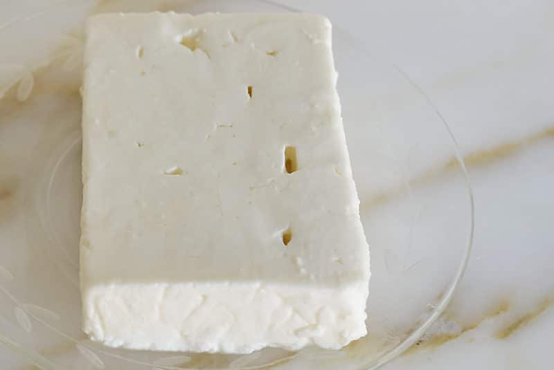 Slice of feta on a glass dish