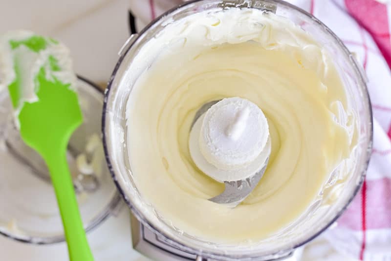 Mini food process with whipped feta and a green spatula