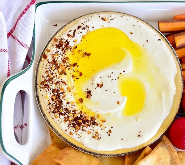 Whipped Feta Dip topped with spices and olive oil