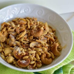 Salted nuts in a white bowl