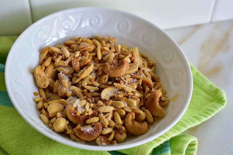 Salted nuts in a white bowl