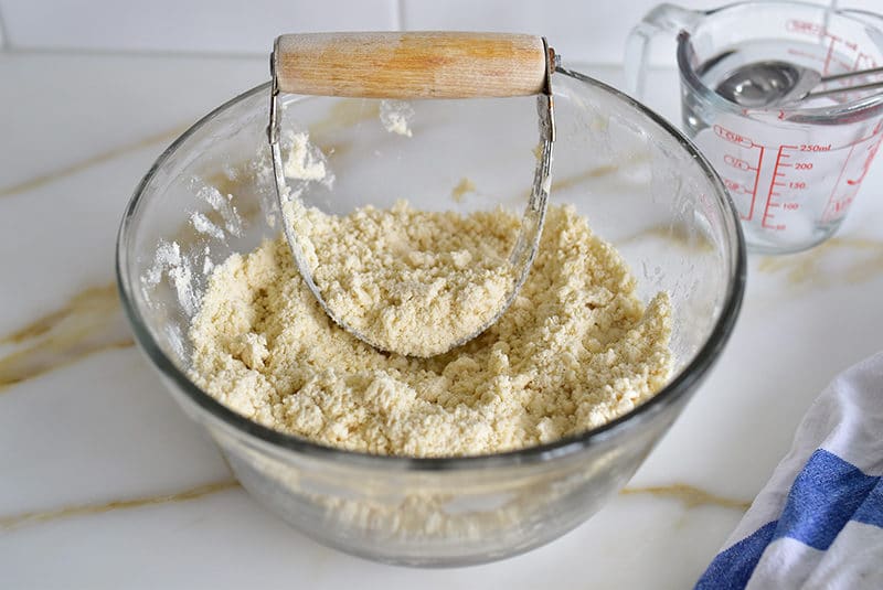 Bowl with pastry cutter and pie dough