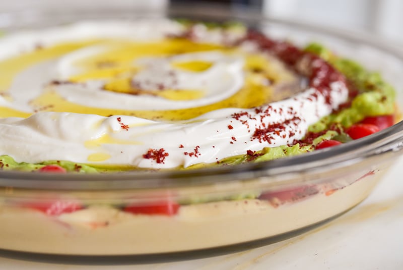 Olive oil and spices on 7 layer dip