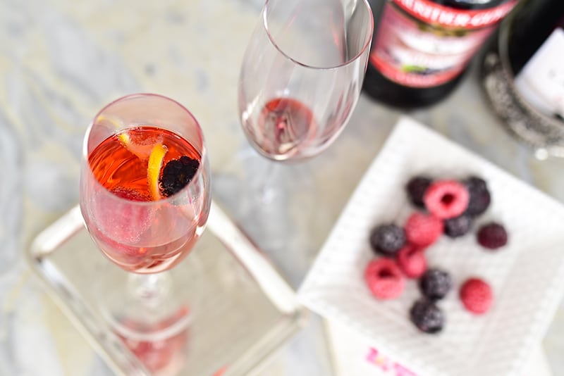 Kir Royale with frozen berries