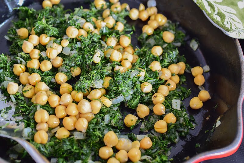Spinach with chickpeas in a creuset saute pan