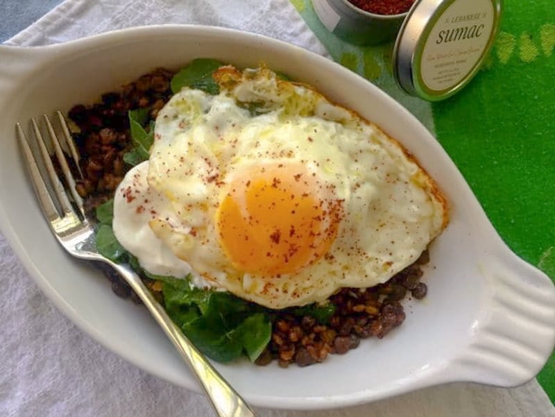 Fried egg in a dish with mujadara