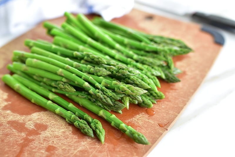 Blanched asparagus on a board