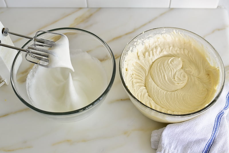Cake batter and whipped egg whites in bowls