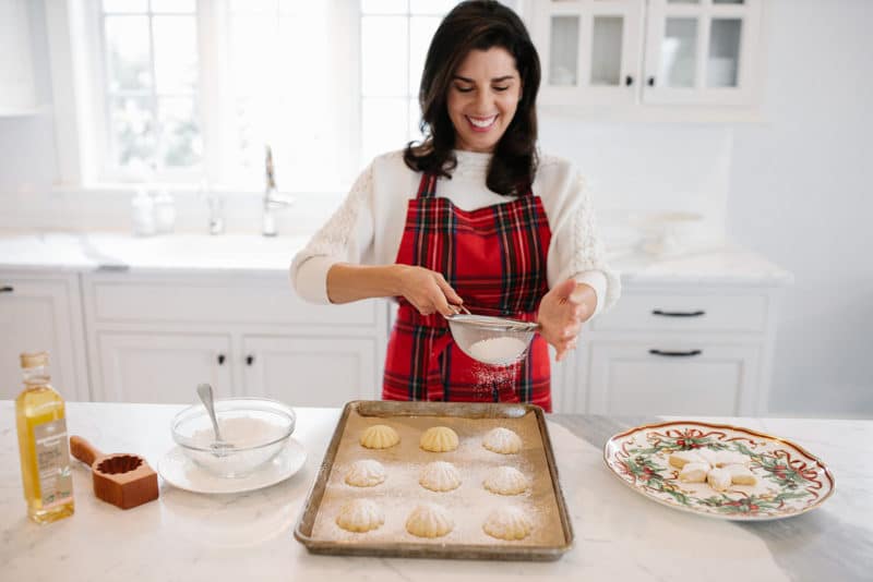 Maureen Abood making maamoul cookies in the kitchen