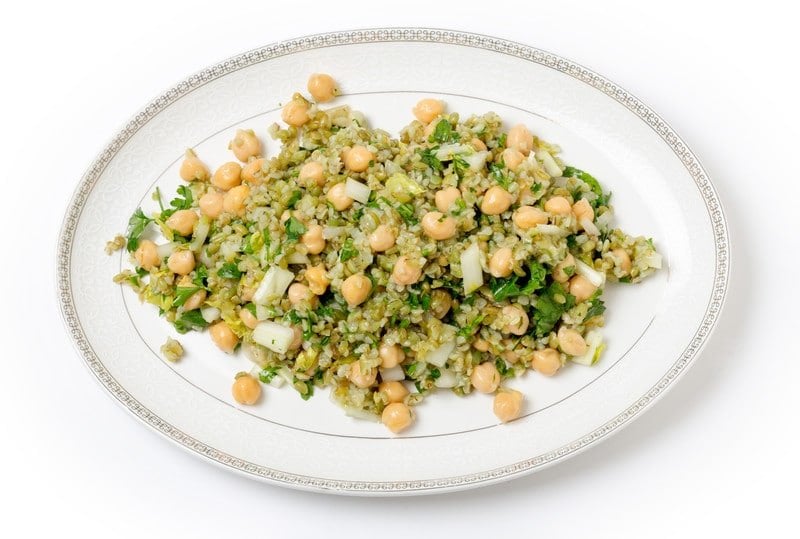 Freekeh chickpea salad on an oval platter