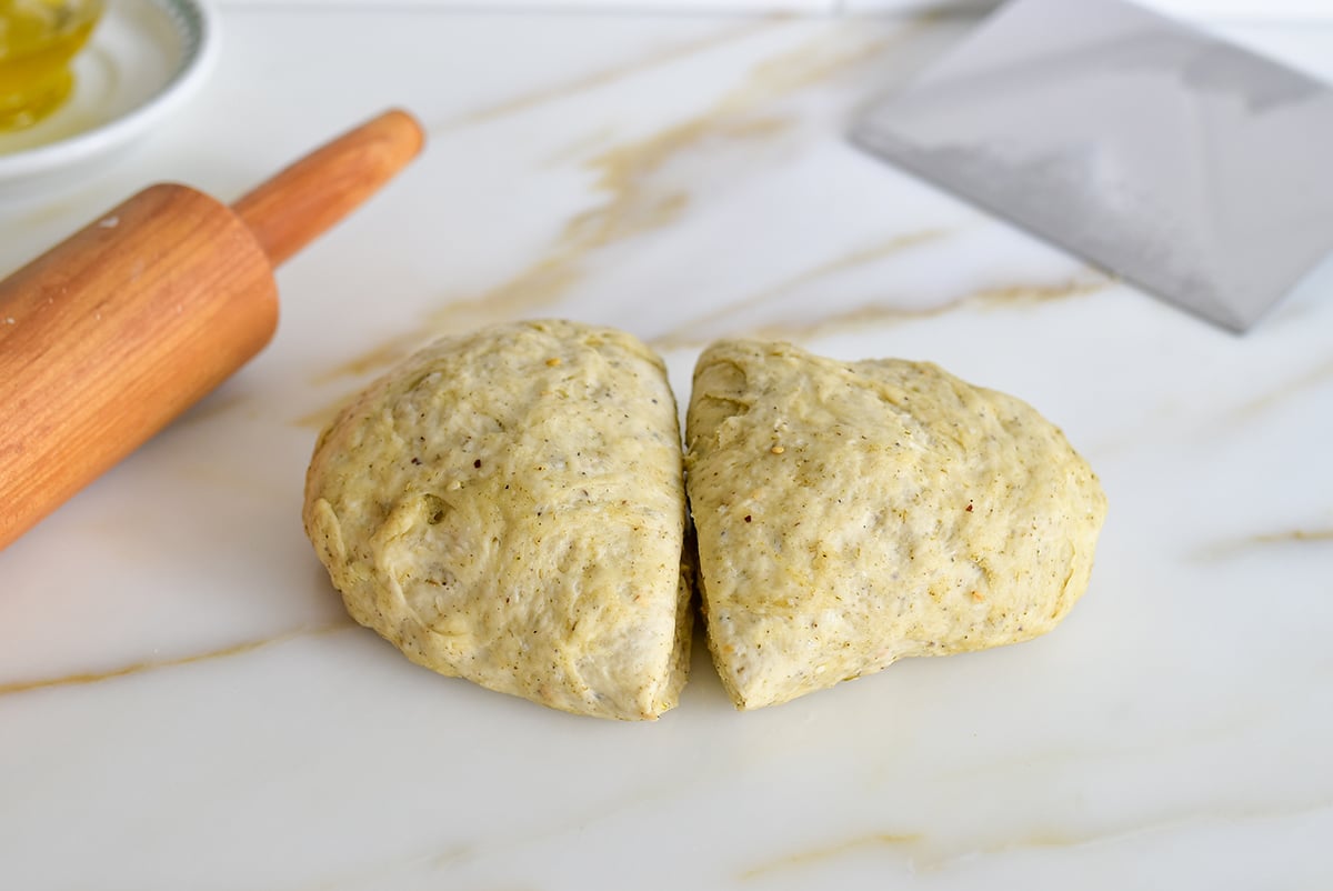 dough for homemade crackers on a marble countertop