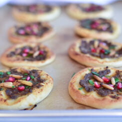Sfeha with meat and pomegranate seeds