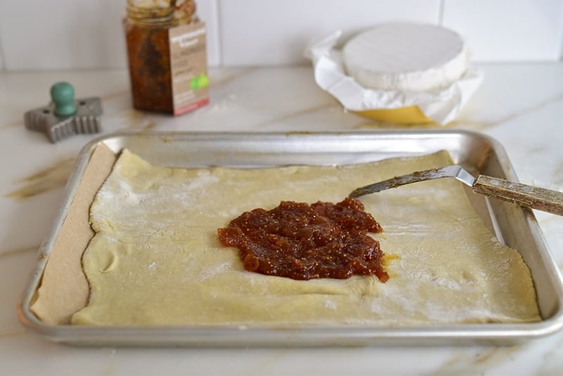 Jam on puff pastry for baked brie