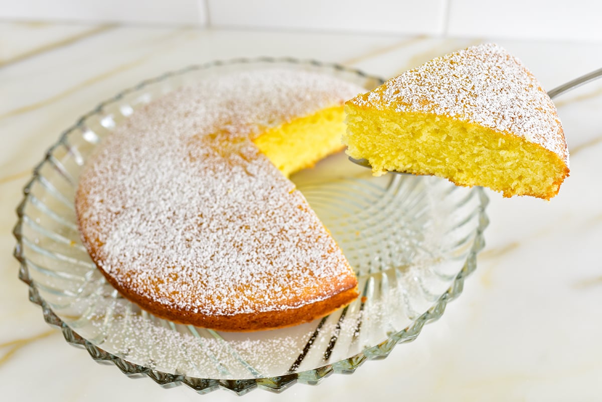 Slice of yellow cake on a cake server
