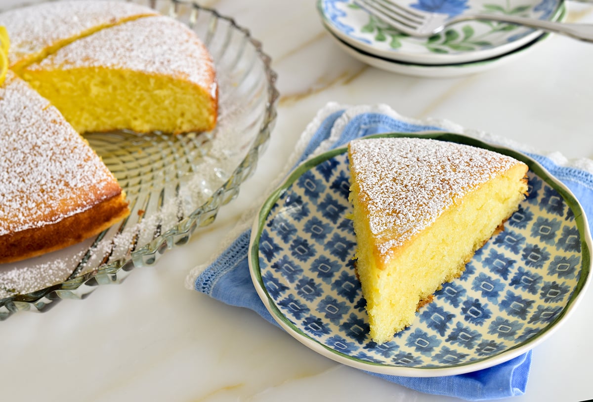 Slice of olive oil cake on a blue plate
