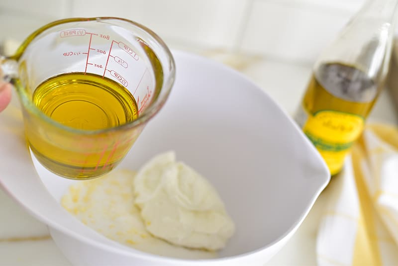 Olive oil for cake batter in a measuring cup