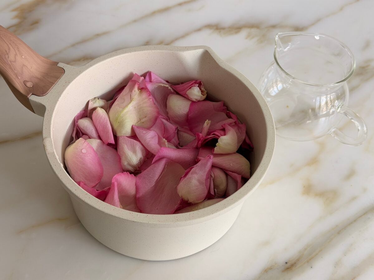 pink rose petals in a white pot