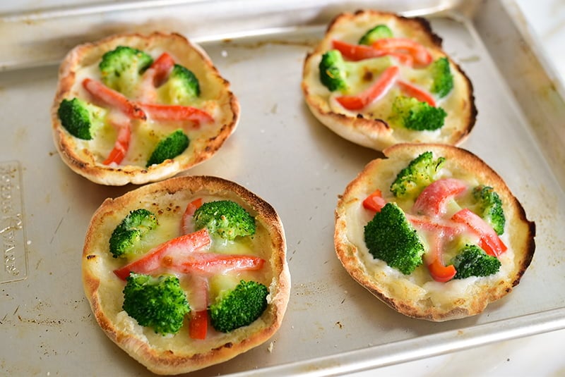 Pita with broccoli on a sheetpan