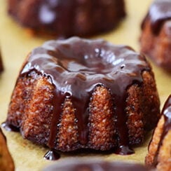 Pumpkin mini bundt cakes with chocolate glaze drips down the sides