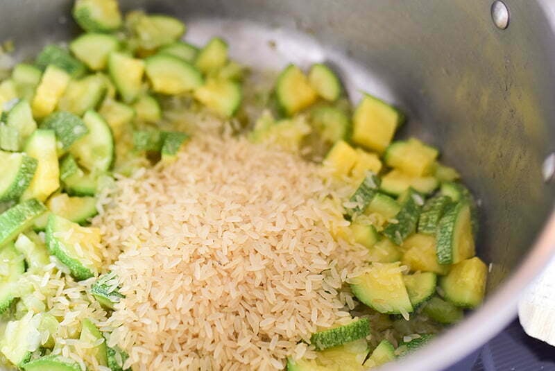 Rice with sauteed koosa in a soup pot