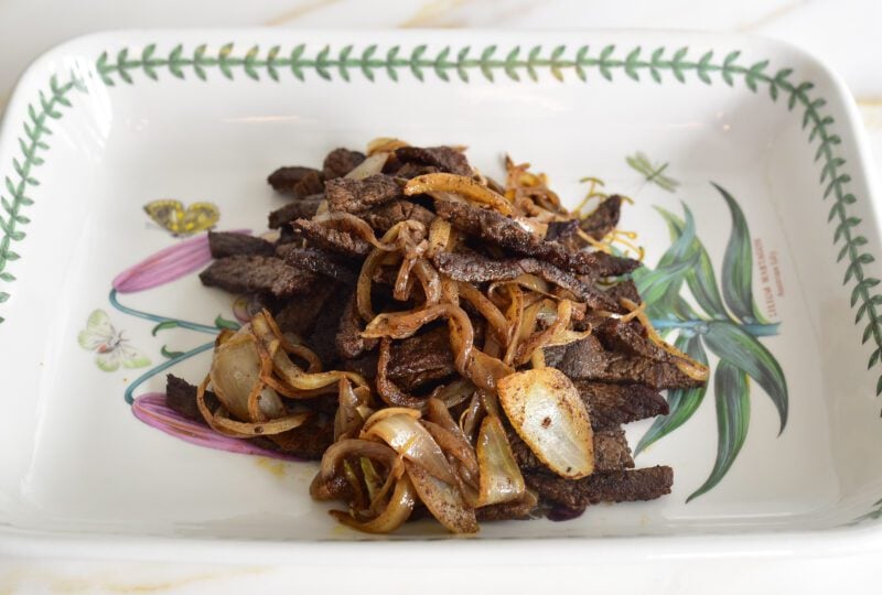 Beef strips on a platter for shawarma