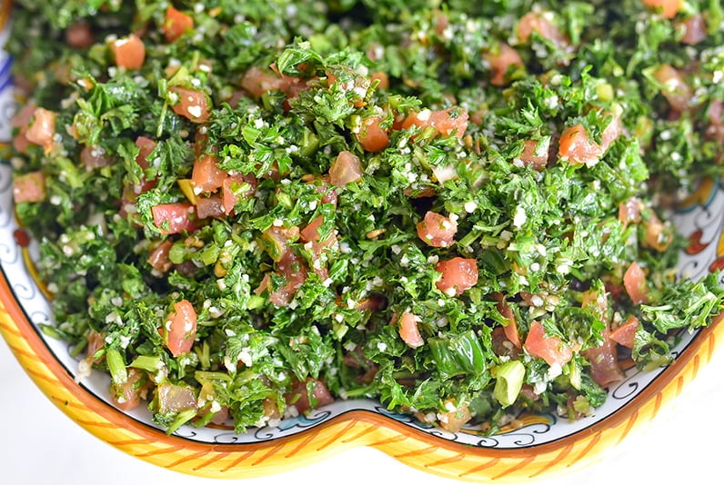 Tabbouleh salad in a dish with yellow trim