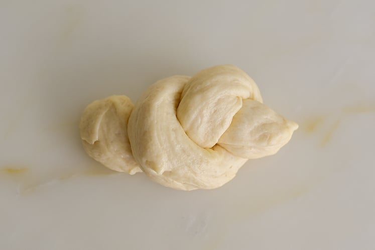Dough tied in a knot on the counter