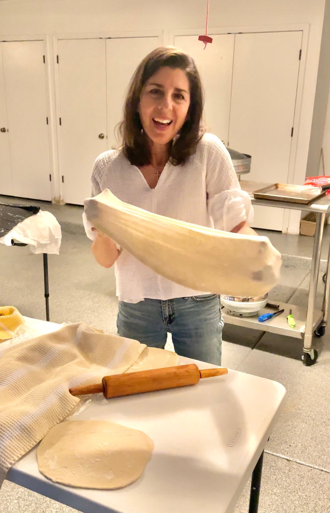 Maureen Abood stretching dough for saj bread