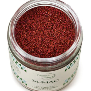 Open top of bright red sumac spice jar