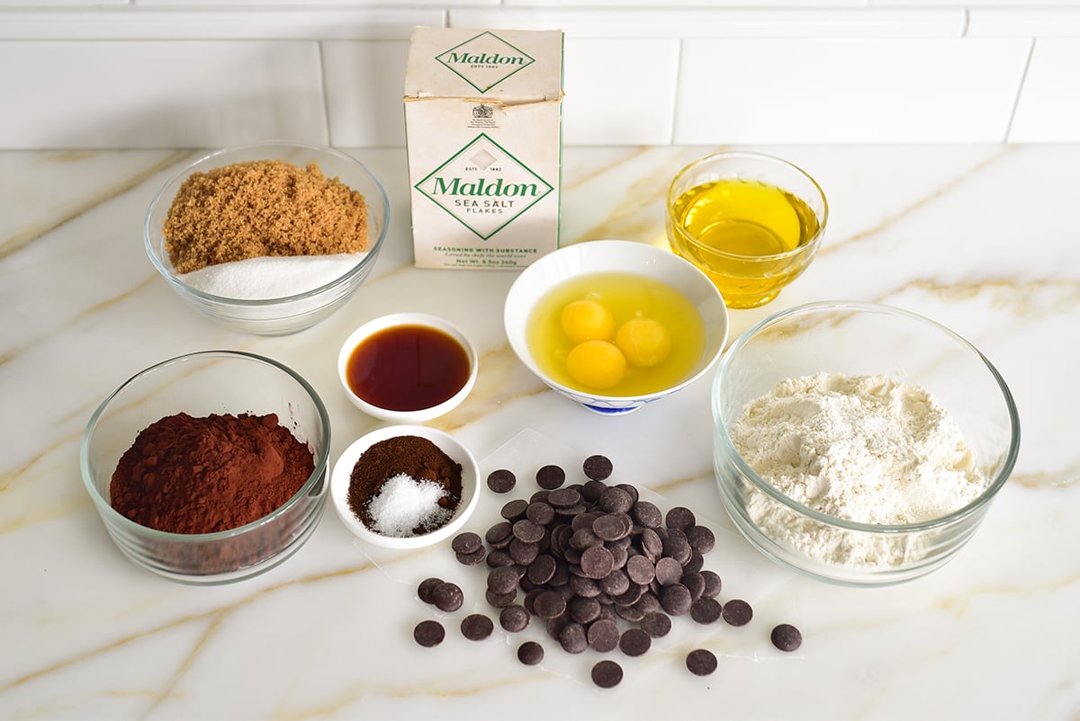 Ingredients for olive oil brownies on a marble surface