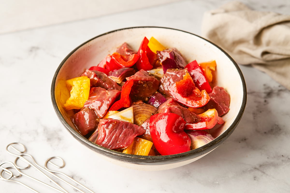 Marinated meat and vegetables in a bowl for shish kebob