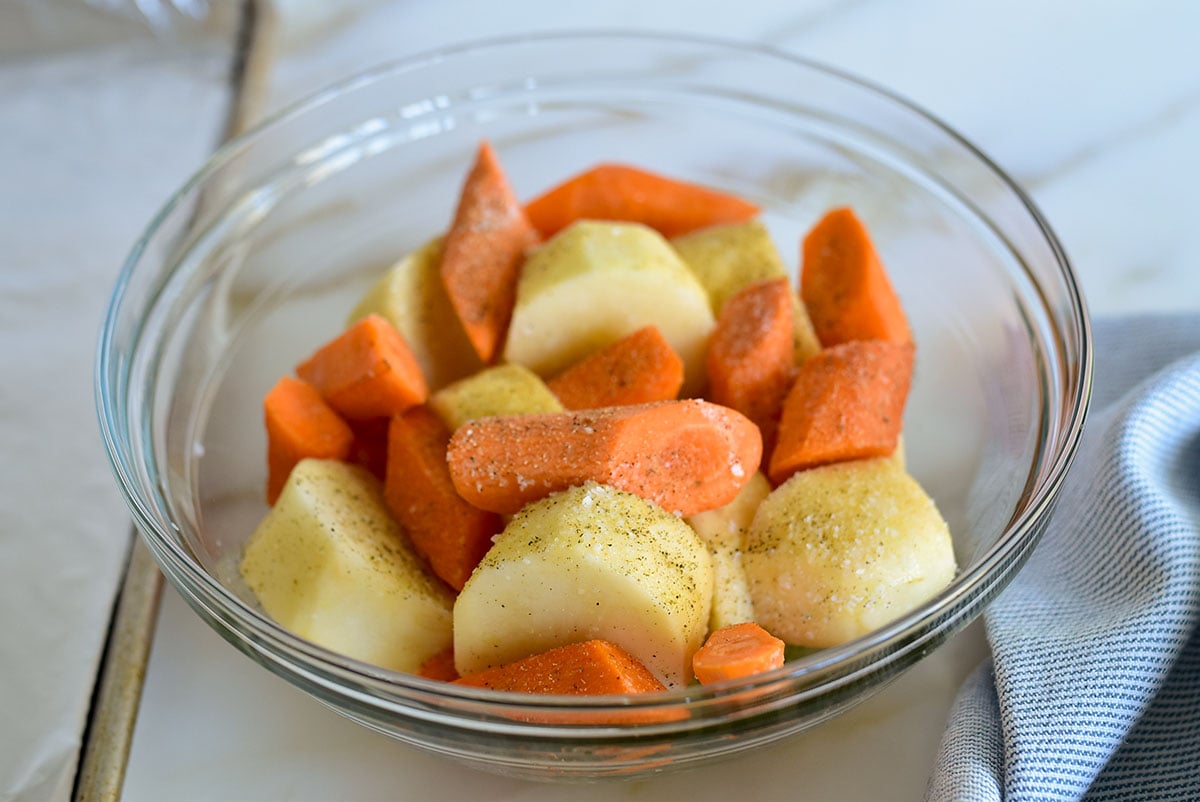 Carrots and potatoes cut up in a bowl