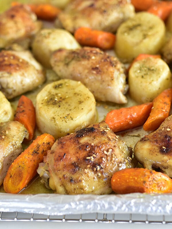 Roasted chicken, potatoes, and carrots on a sheet pan