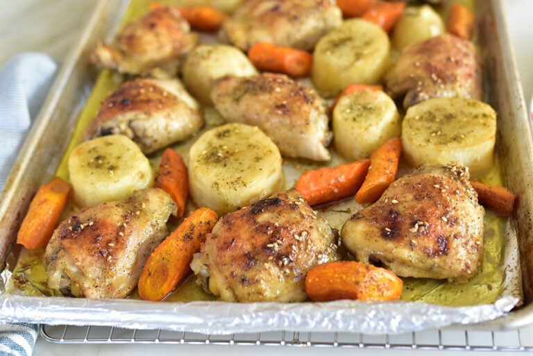 Roasted chicken, potatoes, and carrots on a sheet pan