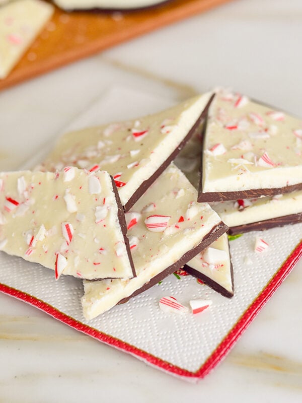 Peppermint bark with white chocolate and crushed candy canes on a red-tipped napkin